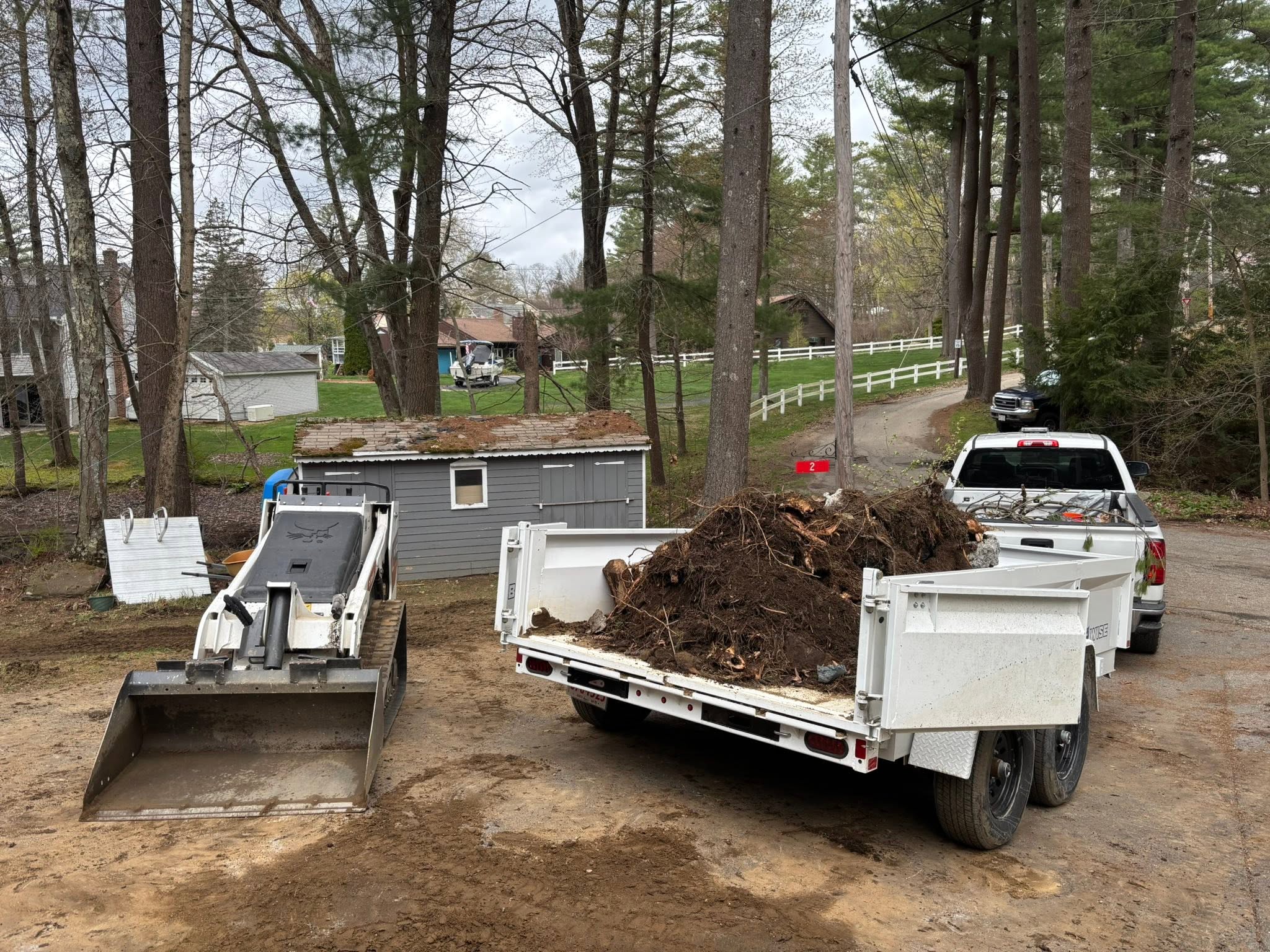 Breaking up and removing concrete pad with equipment